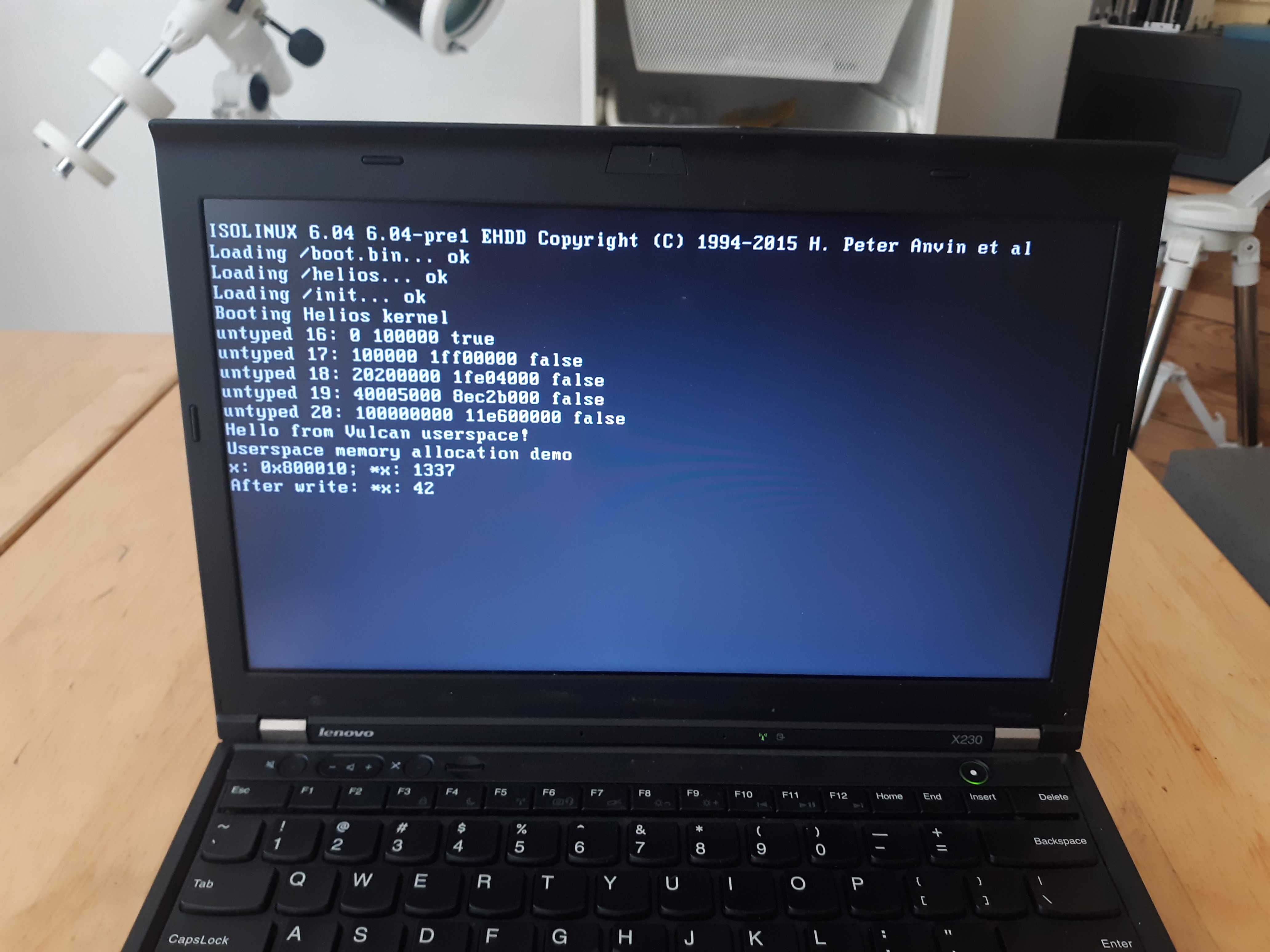 A picture of a ThinkPad running Helios, demonstrating userspace memory allocation